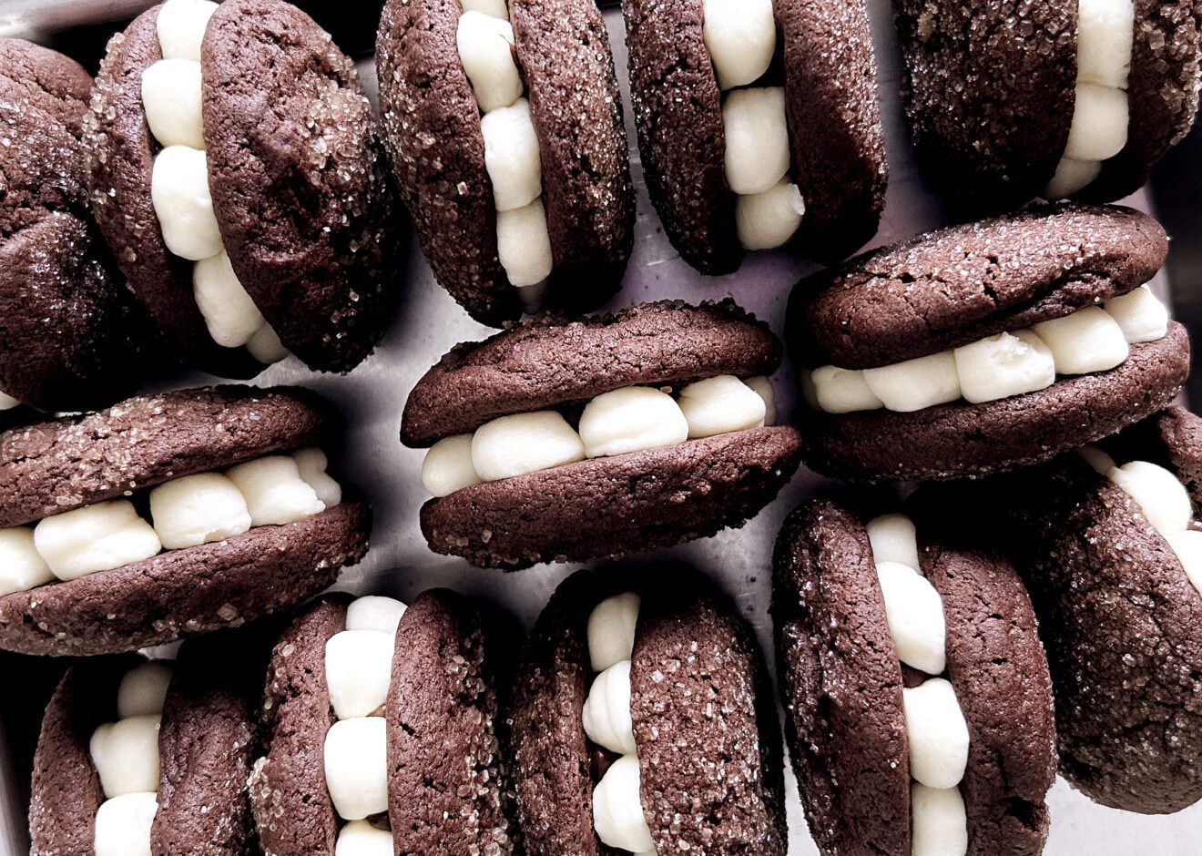 Tray of cream cheese and chocolate ganache filled Tuxedo Cookies.