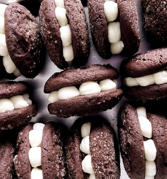 Tray of cream cheese and chocolate ganache filled Tuxedo Cookies.